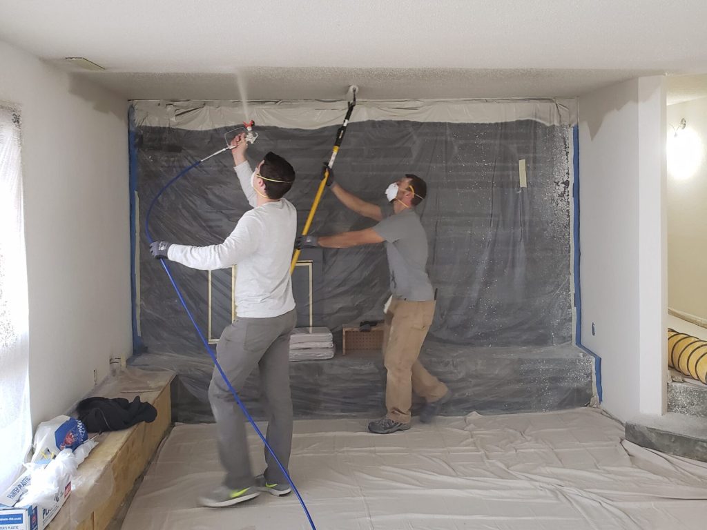 Dean Henderson, owner of Blue Ladder Construction installing a new bedroom floor in Rapid City.