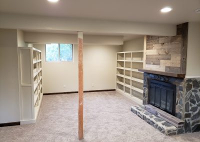 Photo of custom book shelves on both sides of the remodeled room.