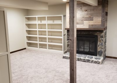 Wider shot of the custom book shelves.