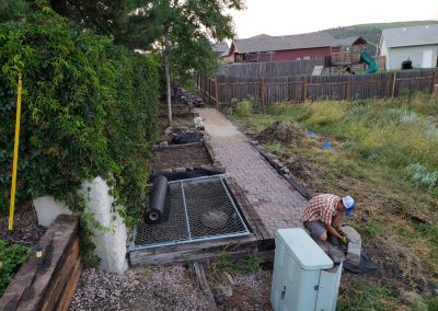 Photo of garden path and garden planting beds .