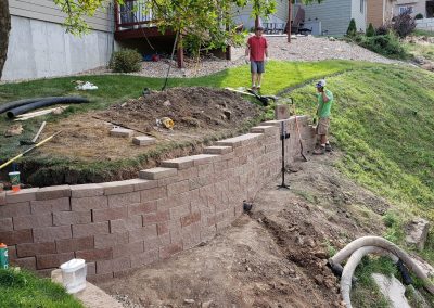 Photo of a custom retaining wall being constructed.
