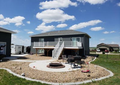 Photo of gray Trex Deck with white fortress railing.