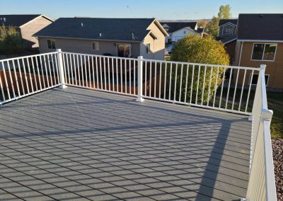 Photo of a top side view of a Juliet deck with white fortress railing.