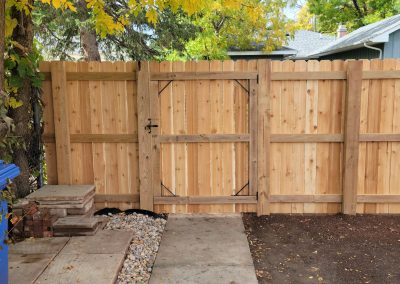 Photo of a single, cedar wood gate.