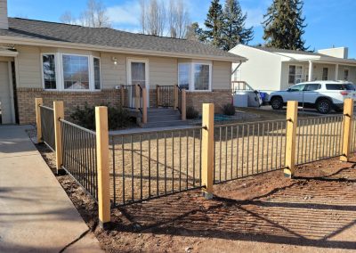 Photo of a fortress railing fence with cedar posts.