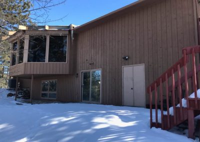 Photo of exterior siding before replacement.